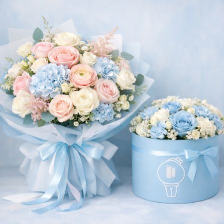 Buket bunga pastel mewah dan flower box biru muda elegan di latar lembut.